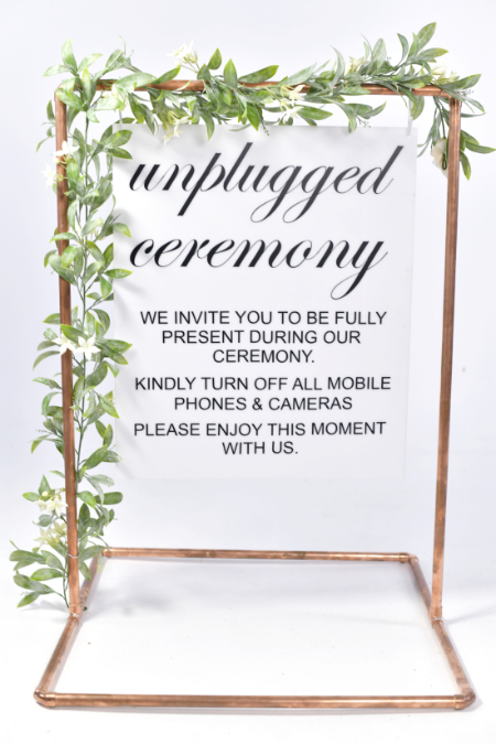 Unplugged wedding sign on copper frame